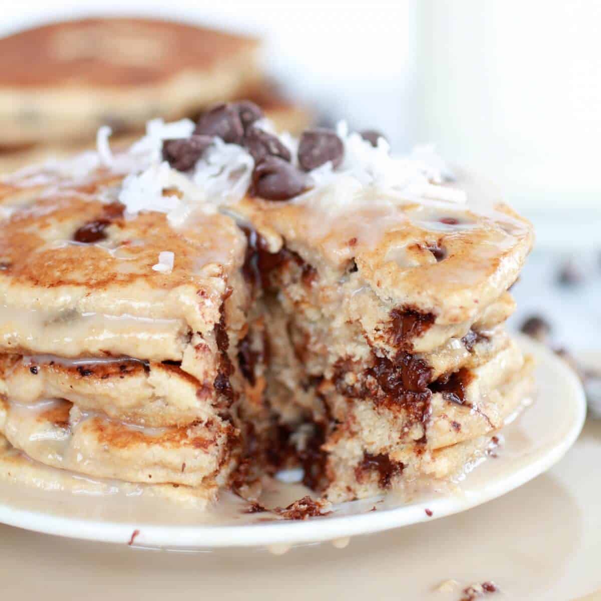 Whole Wheat Chocolate Chip Banana Bread Pancakes with a Vanilla Coconut Glaze