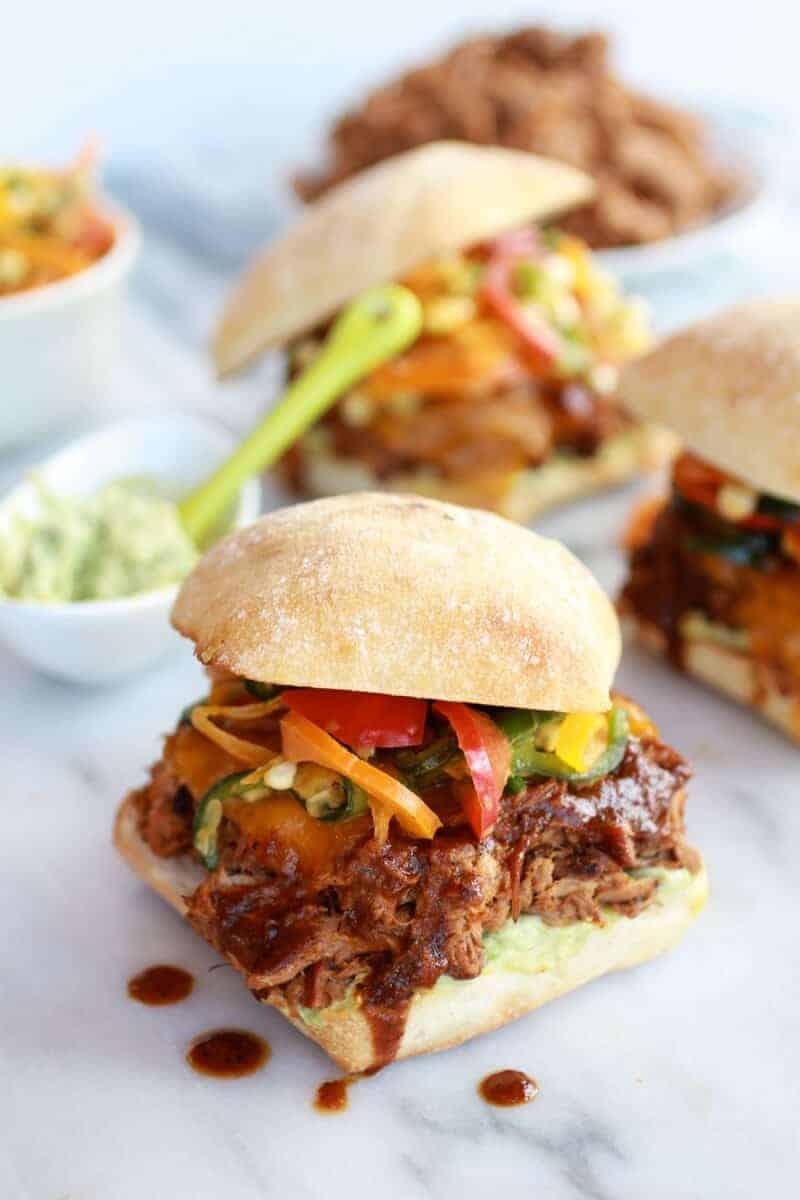 Cheesy Crockpot Cajun Pulled Pork with Southwest Pepper-Corn Slaw | halfbakedharvest.com