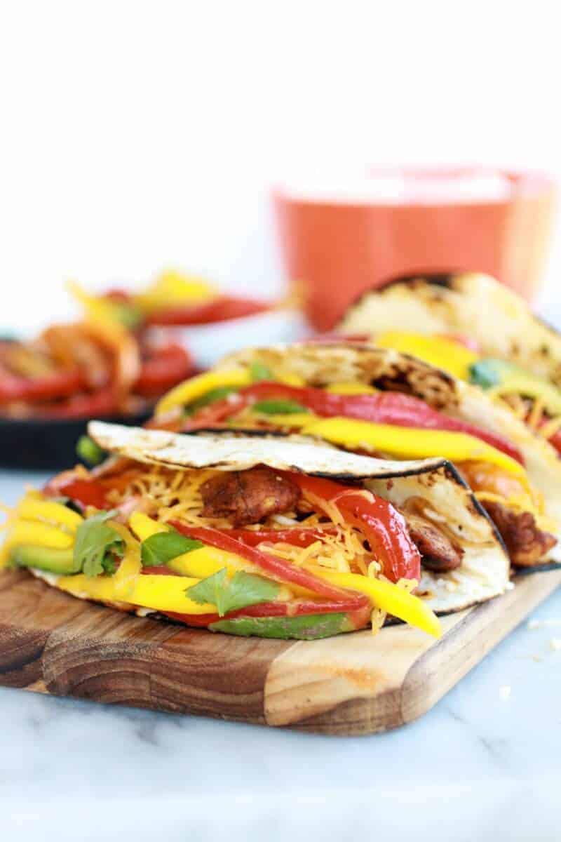 Easy Chicken Fajitas with Thai Mango Slaw and Coconut Rice | halfbakedharvest.com/