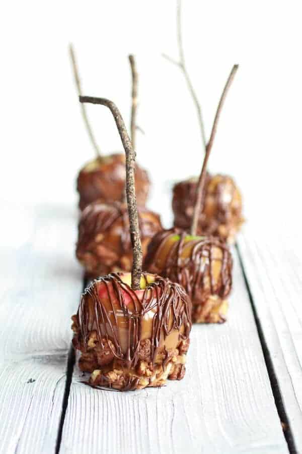 Sweet and Salty Bourbon Cinnamon Pecan Caramel Apples + Chocolate Drizzle | halfbakedharvest.com