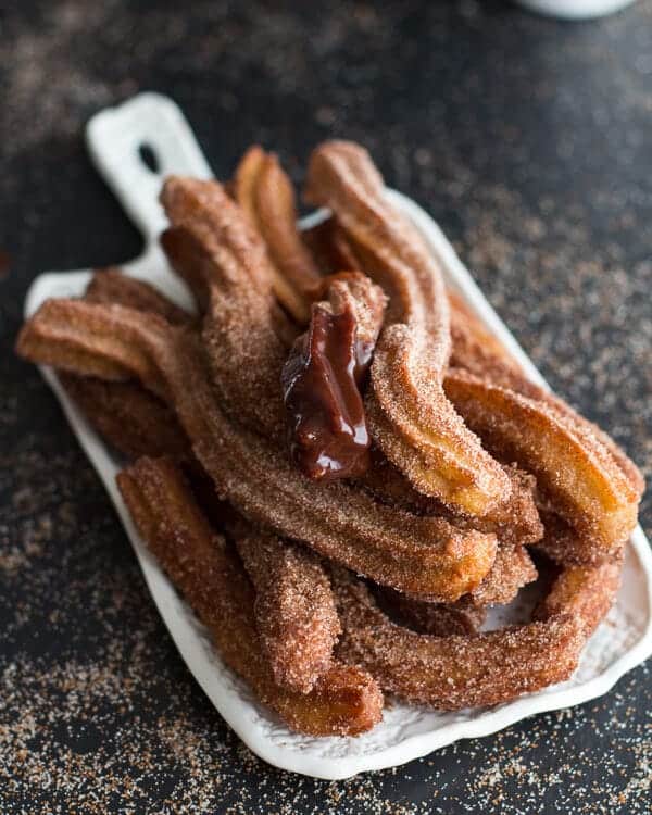 Mexican Beer Spiked Churros with Chocolate Dulce De Leche | halfbakedharvest.com