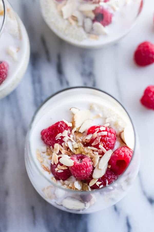 Vanilla Bean Coconut Quinoa Pudding with Honey Drizzled Raspberries | halfbakedharvest.com