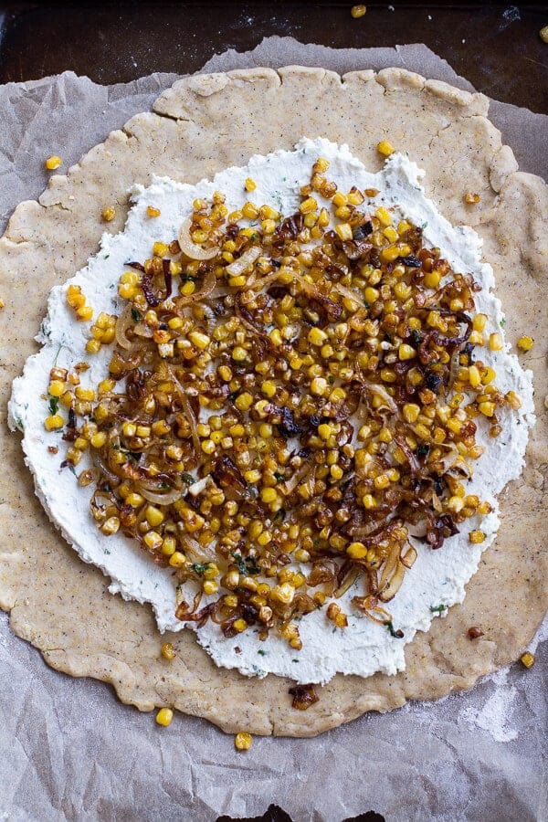 Caramelized Corn and Heirloom Tomato Galette w-Herbed Roasted Garlic Goat Cheese | halfbakedharvest.com @hbharvest