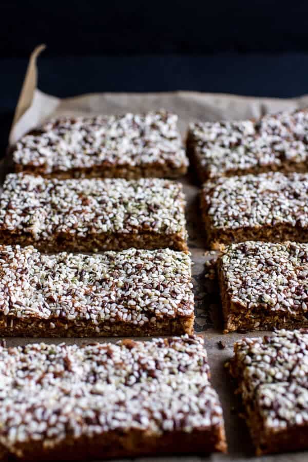 Dark Chocolate Dipped Crunchy Coconut Cashew Sesame Bars | halfbakedharvest.com @hbharvest