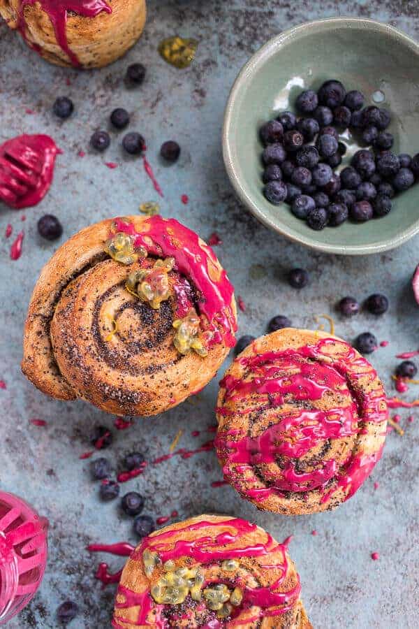 Meyer Lemon Poppy Seed Morning Buns with Blueberry Passionfruit Glaze | halfbakedharvest.com @hbharvest