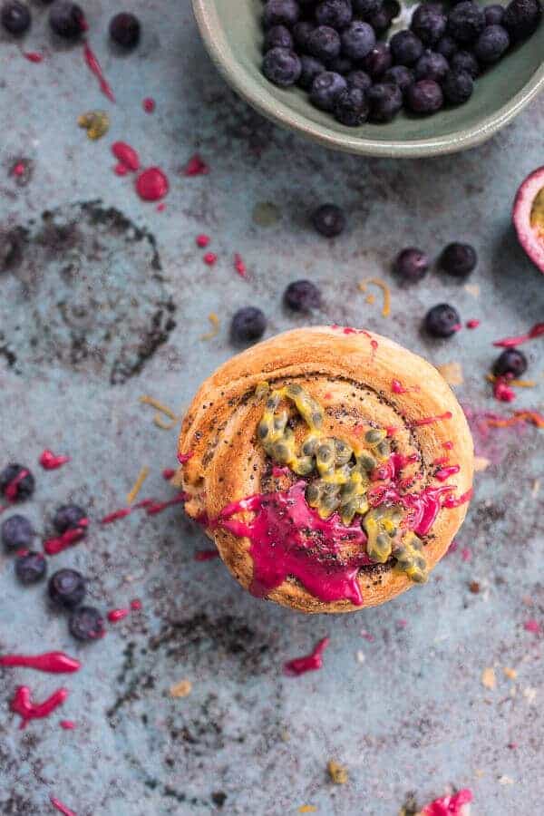 Meyer Lemon Poppy Seed Morning Buns with Blueberry Passionfruit Glaze | halfbakedharvest.com @hbharvest