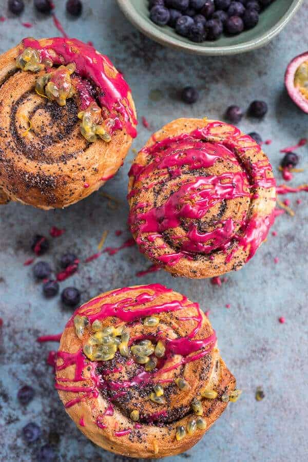 Meyer Lemon Poppy Seed Morning Buns with Blueberry Passionfruit Glaze | halfbakedharvest.com @hbharvest