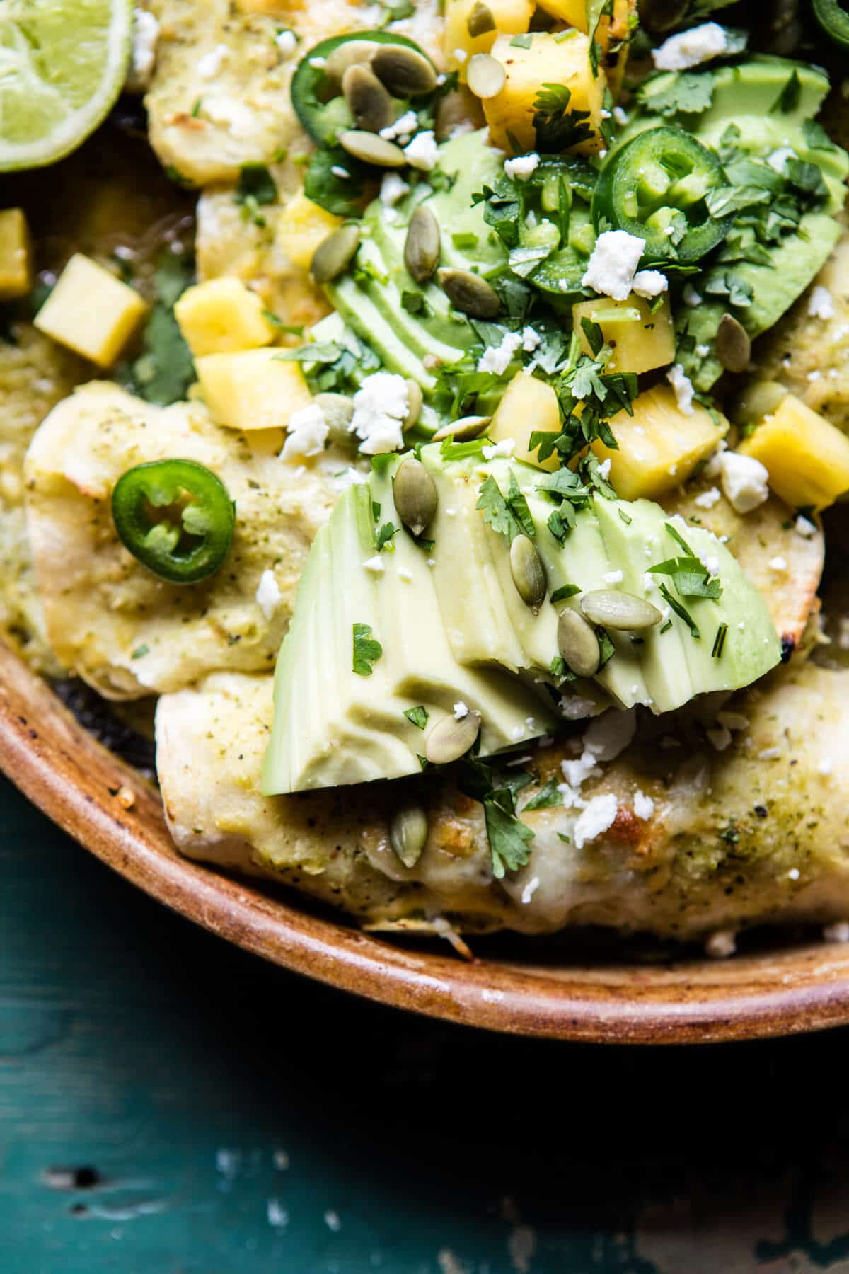 Lightened Up Salsa Verde Chicken Enchiladas with Pineapple Avocado Salsa | halfbakedharvest.com @hbharvest