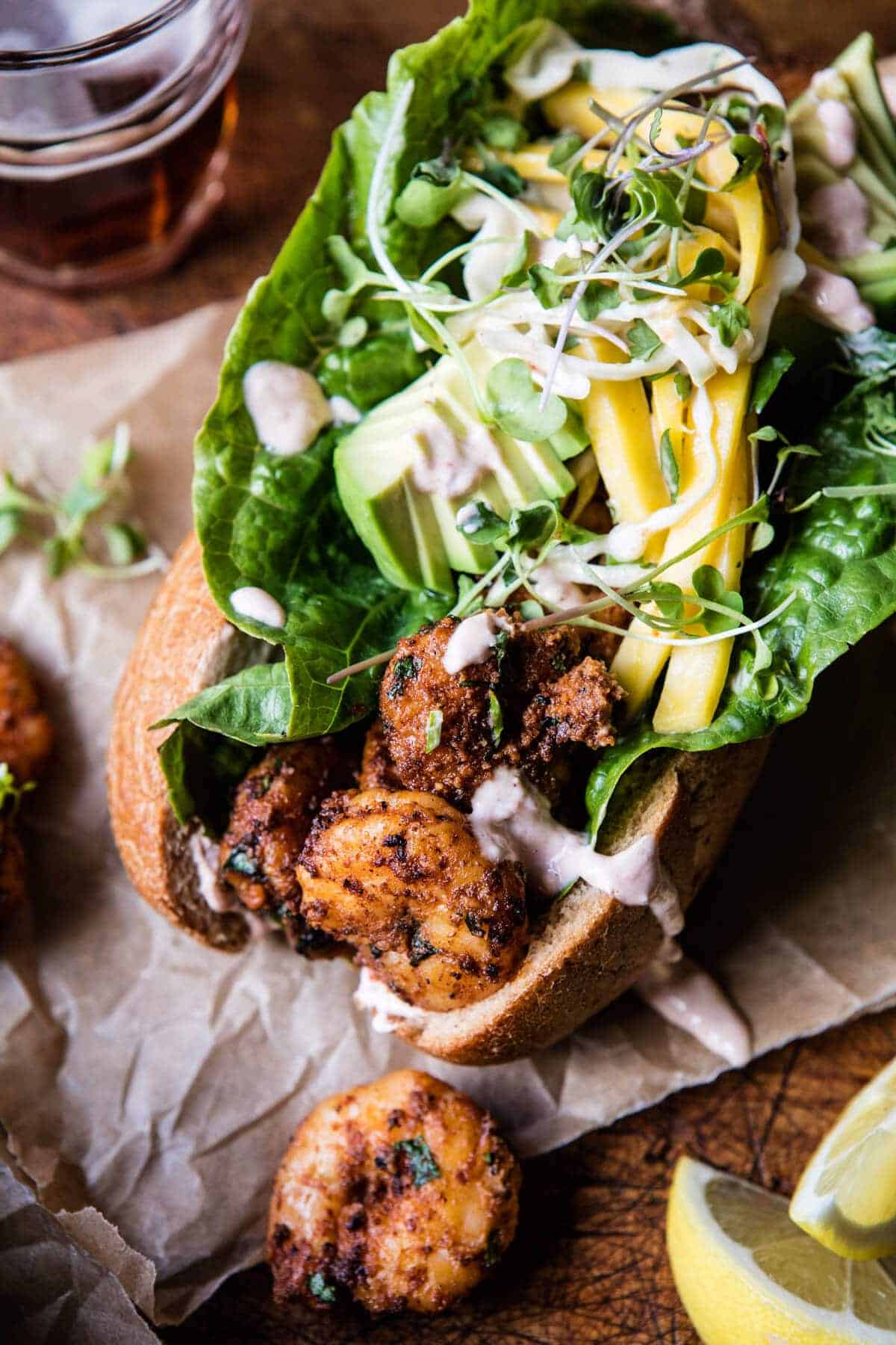 Lighter Shrimp Po Boys with Avocado Mango Slaw | halfbakedharvest.com @hbharvest