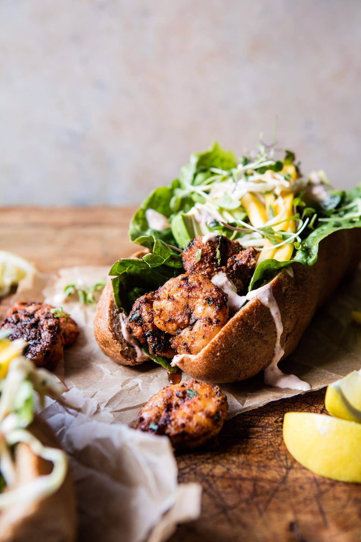 Lighter Shrimp Po Boys with Avocado Mango Slaw | halfbakedharvest.com @hbharvest