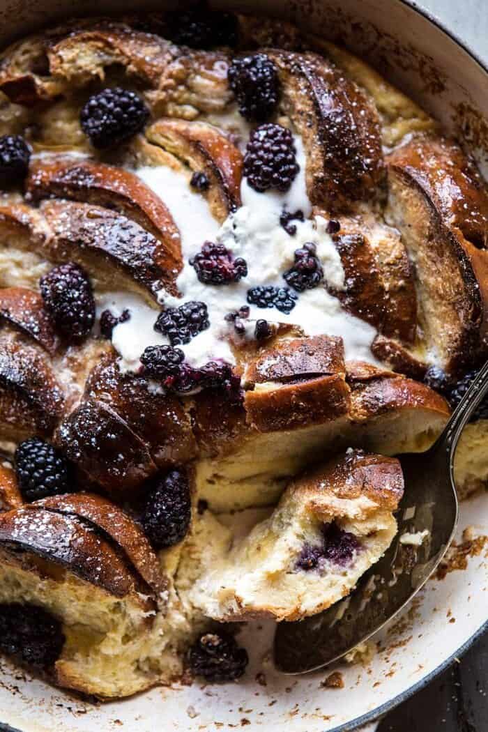 Baked Blackberry Ricotta French Toast | halfbakedharvest.com #breakfast #brunch #easy #recipes overhead photo of cut into Baked Blackberry Ricotta French Toast with bite out