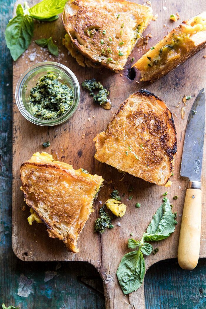 Breakfast Grilled Cheese with Soft Scrambled Eggs and Pesto | halfbakedharvest.com #breakfast #brunch #grilledcheese overhead photo of Breakfast Grilled Cheese with Soft Scrambled Eggs and Pesto