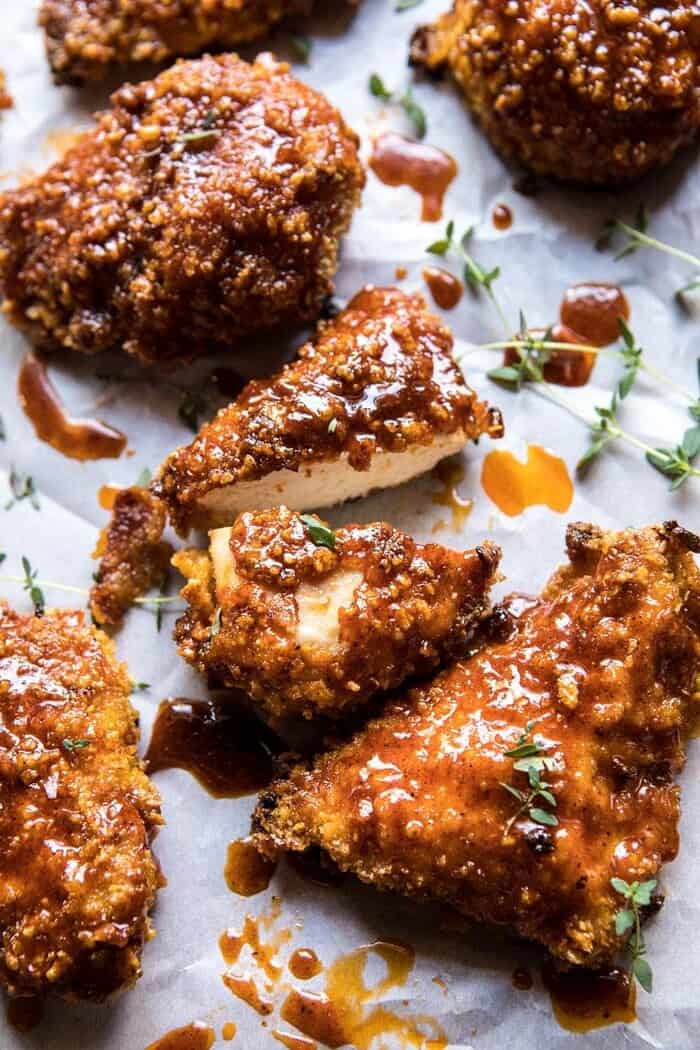 Oven Fried Southern Hot Honey Chicken | halfbakedharvest.com #chicken #healthy #recipes #easy angled photo of Oven Fried Southern Hot Honey Chicken that has been cut into