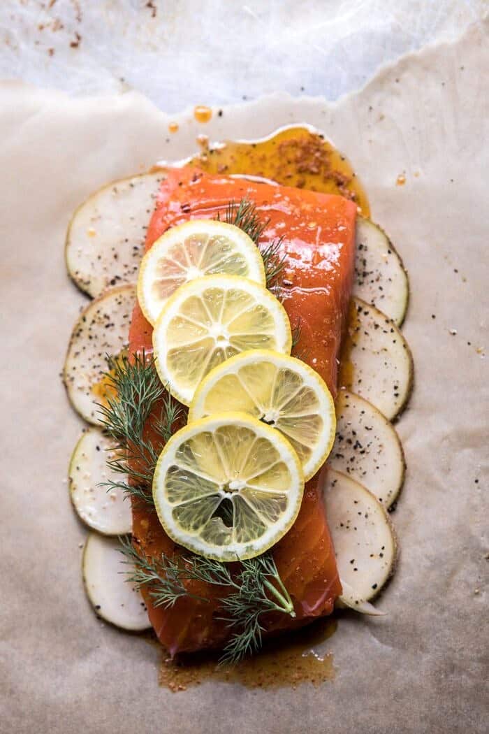 Parchment Baked Lemon Salmon and Potatoes with Dill Yogurt | halfbakedharvest.com #healthy #recipe #salmon #easyrecipe prep photo of raw uncooked Parchment Baked Lemon Salmon and Potatoes with Dill Yogurt