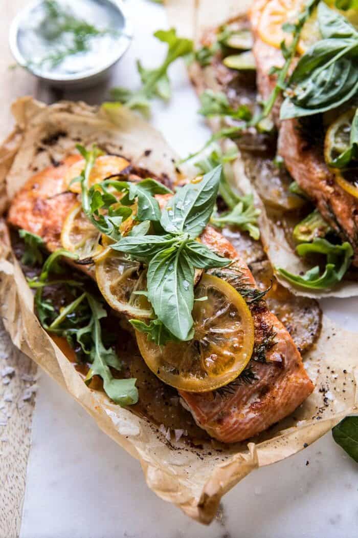 Parchment Baked Lemon Salmon and Potatoes with Dill Yogurt | halfbakedharvest.com #healthy #recipe #salmon #easyrecipe side angle photo of Parchment Baked Lemon Salmon and Potatoes with Dill Yogurt