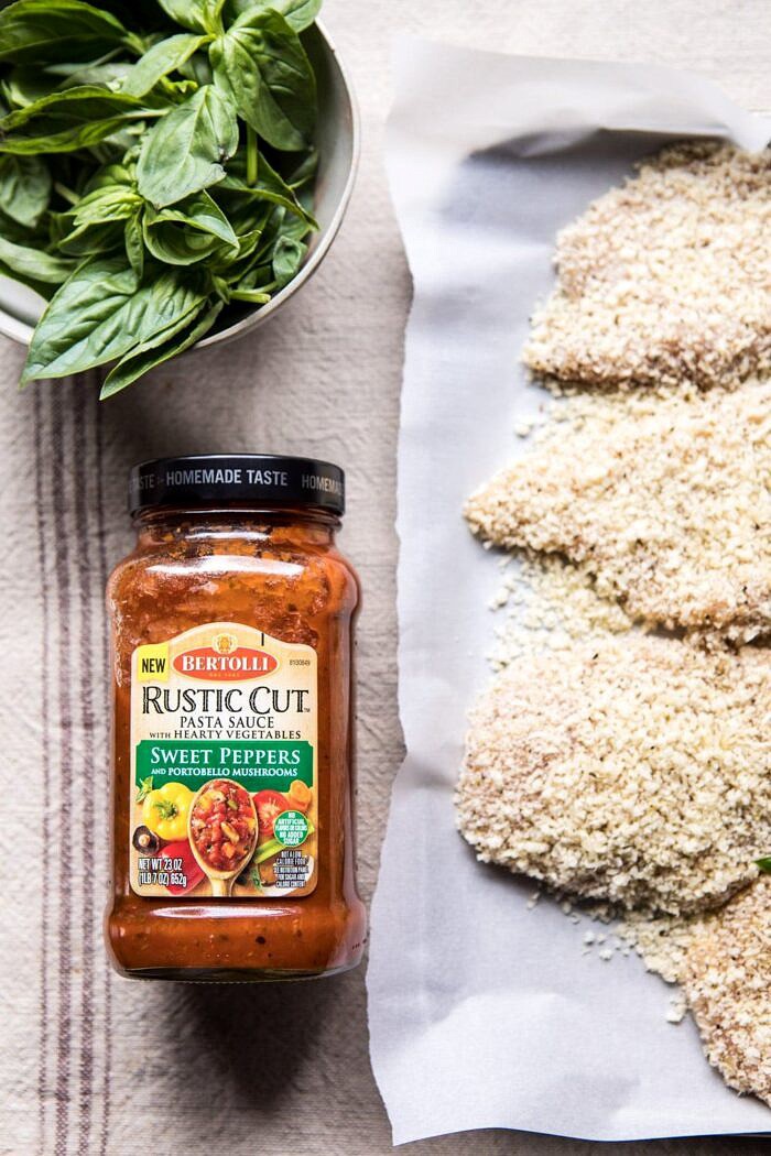 Spring Chicken Parmesan with Tuscan Kale Pesto | halfbakedharvest.com #chicken #recipe #healthy prep photo with pasta sauce and Spring Chicken Parmesan