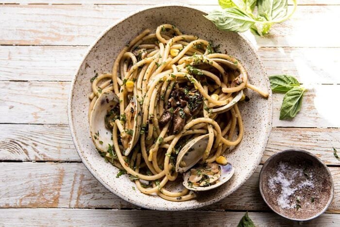 Buttery Mushroom and Clam Pasta | halfbakedharvest.com #pasta #easyrecipe #summerrecipes overhead horizontal photo of Buttery Mushroom and Clam Pasta