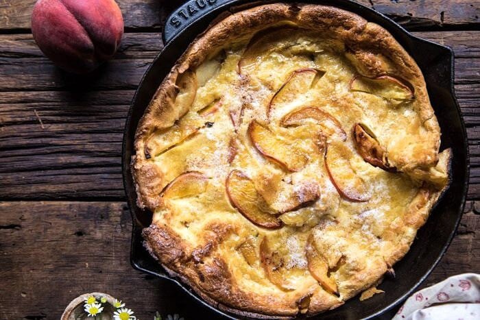 overhead horizontal photo of Browned Butter Cinnamon Peach Dutch Baby