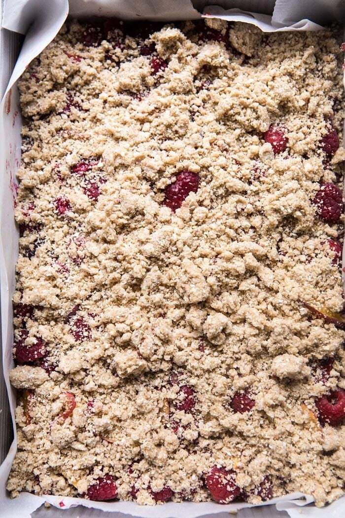 Buttery Raspberry Crumble Bars | halfbakedharvest.com #raspberry #dessert #summer #backtoschool #easyrecipes overhead photo of d Buttery Raspberry Crumble Bars before baking