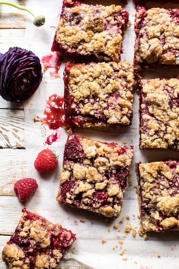 Buttery Raspberry Crumble Bars | halfbakedharvest.com #raspberry #dessert #summer #backtoschool #easyrecipes overhead photo of Buttery Raspberry Crumble Bars with bars cuts into squares