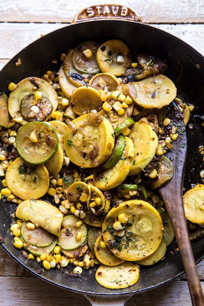 overhead photo of zucchini and corn in staub skillet 