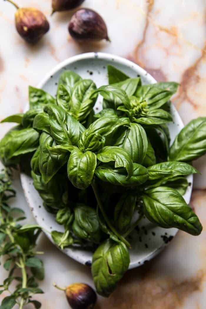 overhead photo of fresh basil and figs 