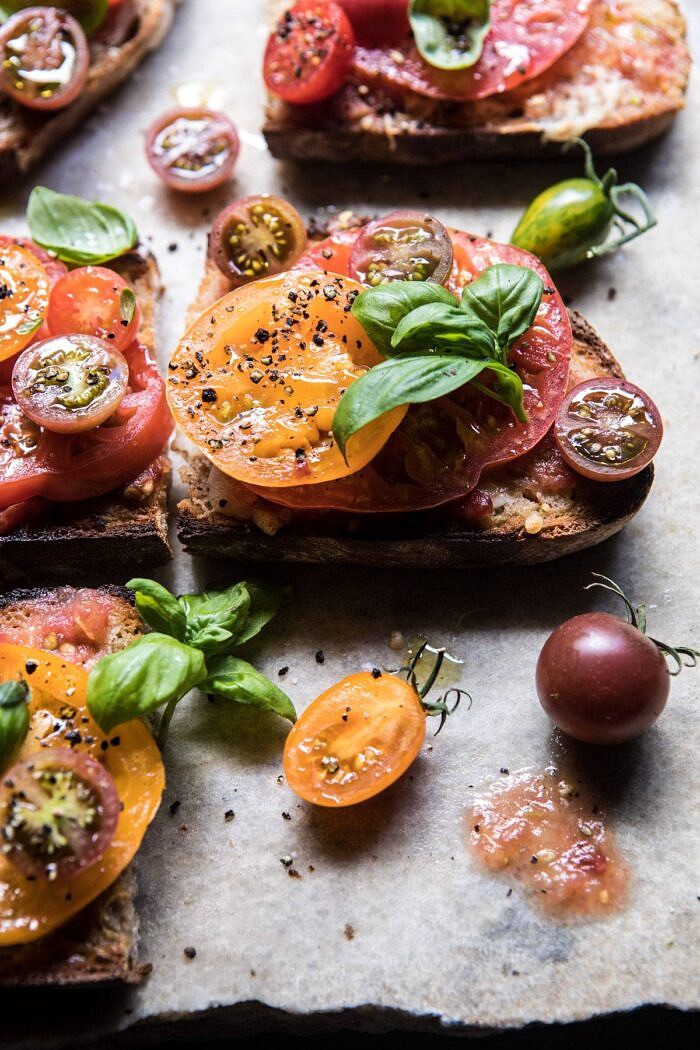 side angled photo of Heirloom Tomato, Basil, and Manchego Toast 
