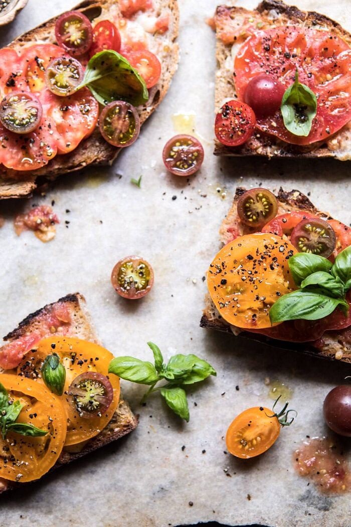 overhead photo of Heirloom Tomato, Basil, and Manchego Toast 