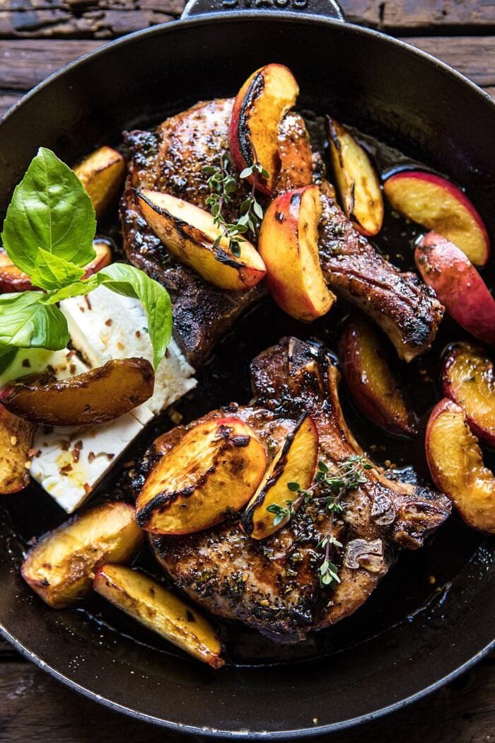 Skillet Balsamic Peach Pork Chops with Feta and Basil | halfbakedharvest.com #peaches #porkchops #easydinner #skilletrecipe