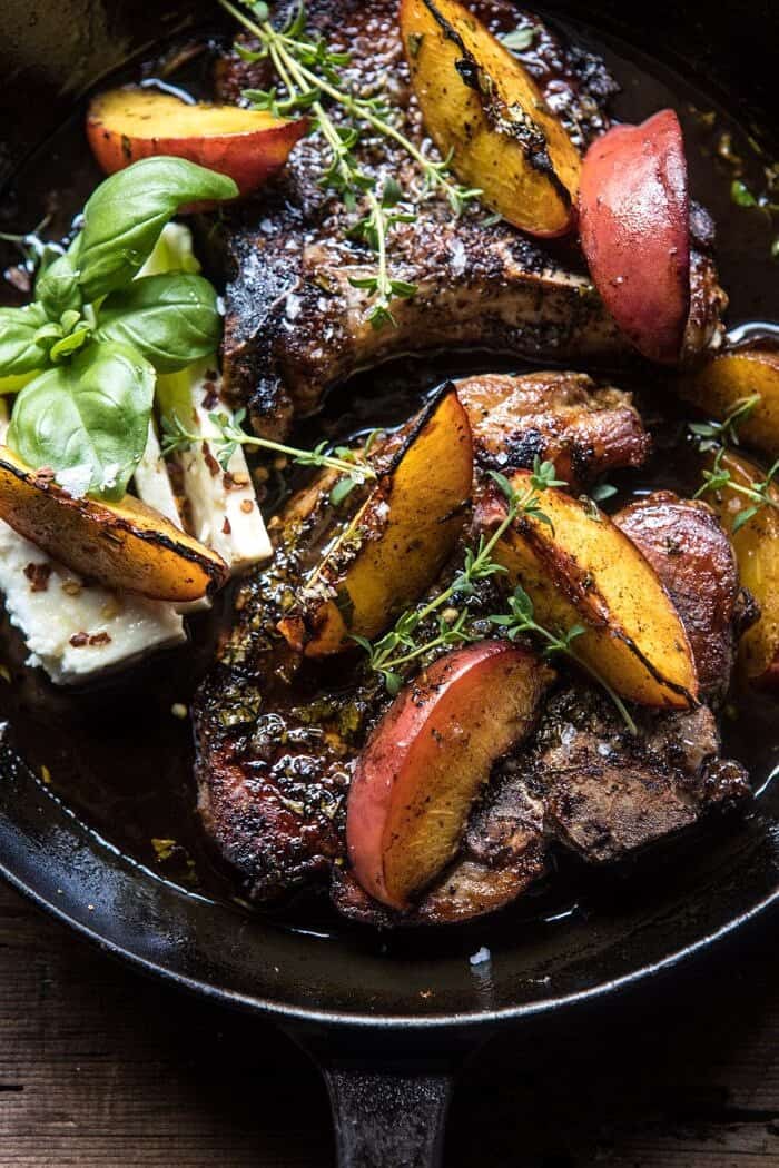 Skillet Balsamic Peach Pork Chops with Feta and Basil | halfbakedharvest.com #peaches #porkchops #easydinner #skilletrecipe overhead close up photo of Skillet Balsamic Peach Pork Chops with Feta and Basil