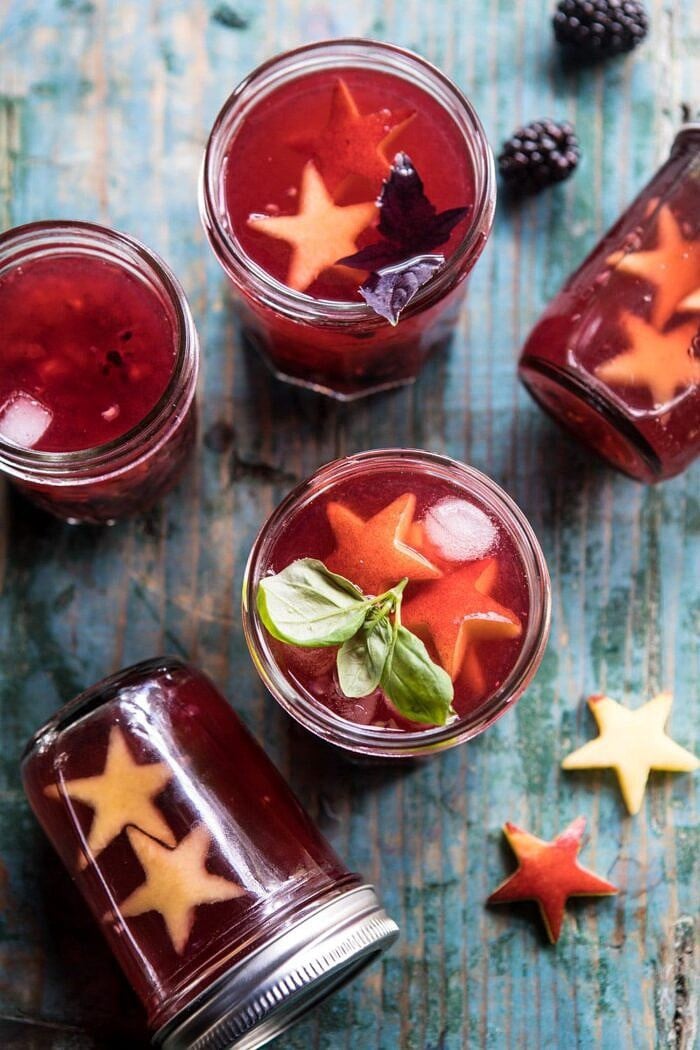 Smashed Berry Rose Spritz | halfbakedharvest.com #cocktails #4thofjulyrecipe #summerrecipes #easy