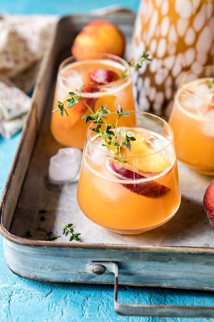 Sweet Bourbon Peach Lemonade | halfbakedharvest.com #peaches #bourbon #lemonade close up photo Sweet Bourbon Peach Lemonade on tray