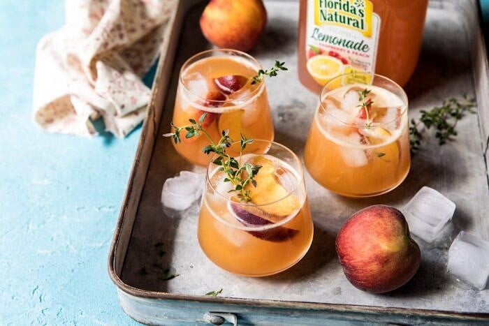 Sweet Bourbon Peach Lemonade | halfbakedharvest.com #peaches #bourbon #lemonade horizontal photo of Sweet Bourbon Peach Lemonade