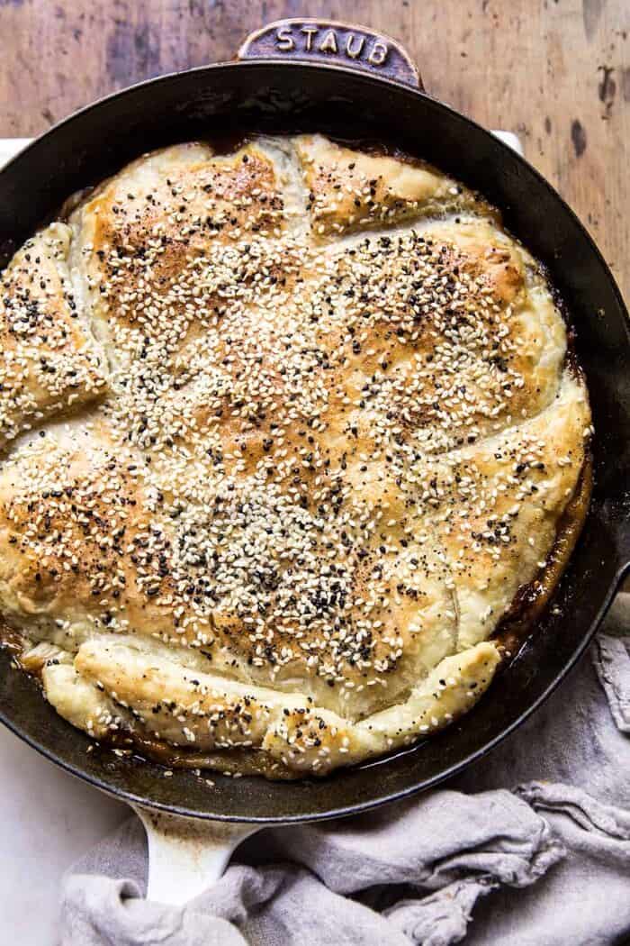 Caramelized Corn and Tomato Tarte Tatin | halfbakedharvest.com #simple #east #tomatoes #summer #tomatotart overhead photo of Caramelized Corn and Tomato Tarte Tatin in skillet