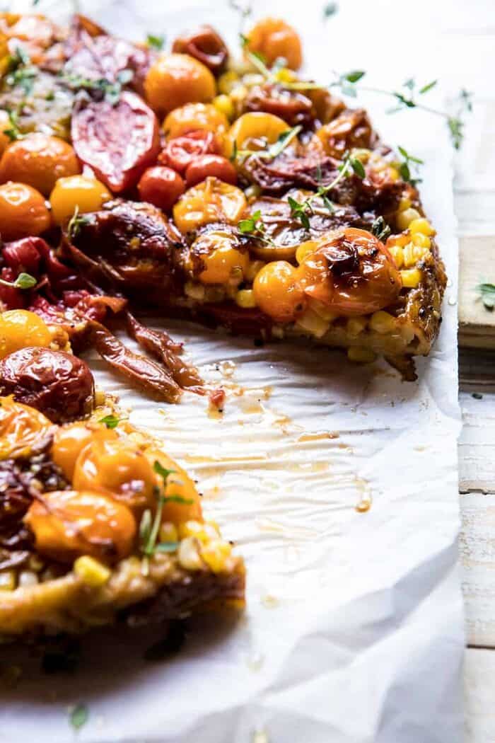 Caramelized Corn and Tomato Tarte Tatin | halfbakedharvest.com #simple #east #tomatoes #summer #tomatotart side angled close up of Caramelized Corn and Tomato Tarte Tatin