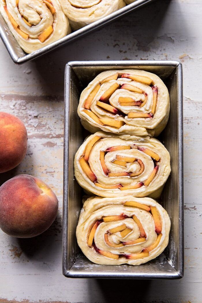 Flaky Pull Apart Cinnamon Peach Brioche Bread | halfbakedharvest.com #bread #brunch #breakfast #peaches #summer #baking overhead photo of Flaky Pull Apart Cinnamon Peach Brioche Bread before baking in bread pan