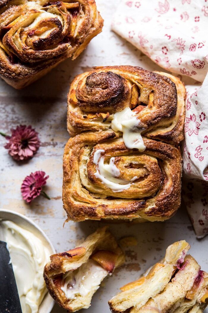Flaky Pull Apart Cinnamon Peach Brioche Bread | halfbakedharvest.com #bread #brunch #breakfast #peaches #summer #baking close up overhead photo of Flaky Pull Apart Cinnamon Peach Brioche Bread