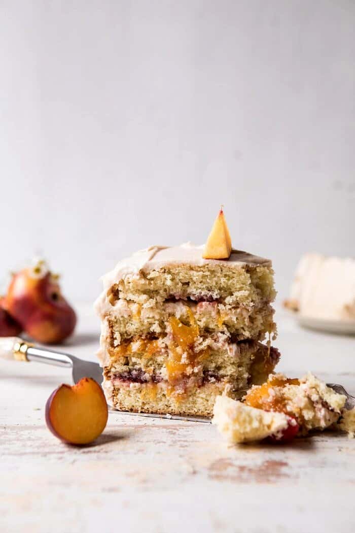 Peach Ricotta Layer Cake with Browned Butter Buttercream with bites removed from cake slice