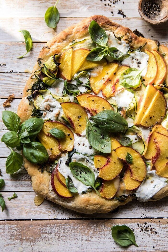 close up photo of Pesto Zucchini and Peach Pizza with Burrata