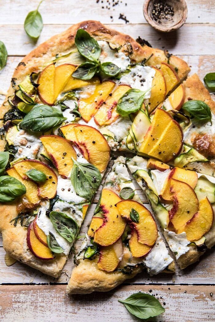 Pesto Zucchini and Peach Pizza with Burrata with 2 slices cut