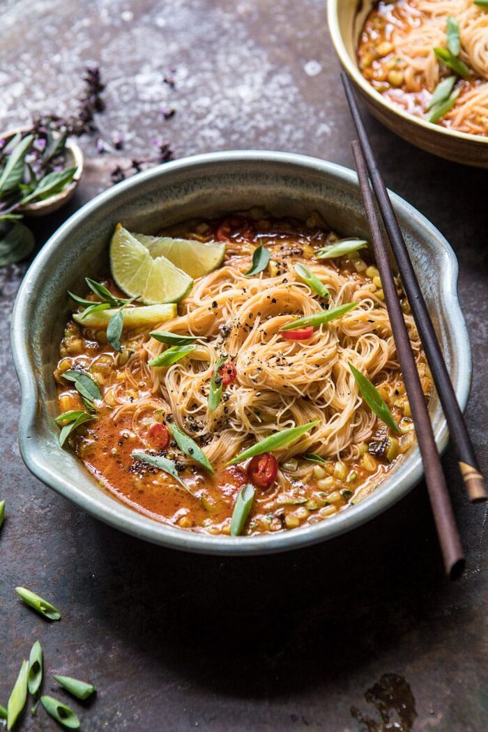 Saucy Coconut Curry with Rice Noodles and Garden Vegetables | halfbakedharvest.com #curry #summerrecipes #easyrecipes #thairecipe #simplerecipes side angled photo of Saucy Coconut Curry with Rice Noodles and Garden Vegetables