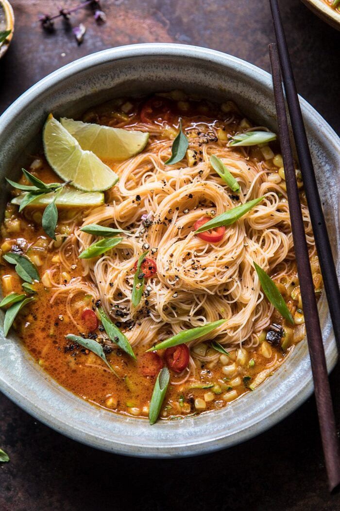 Saucy Coconut Curry with Rice Noodles and Garden Vegetables | halfbakedharvest.com #curry #summerrecipes #easyrecipes #thairecipe #simplerecipes overhead close up photo of Saucy Coconut Curry with Rice Noodles and Garden Vegetables