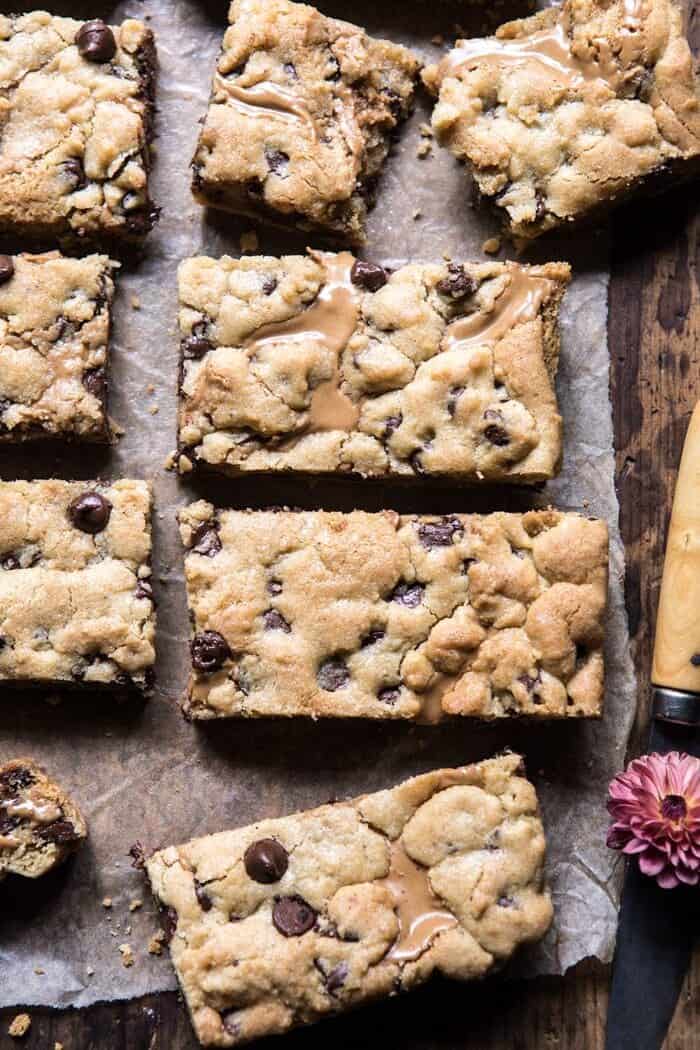 The Best Chocolate Chip Peanut Butter Swirled Cookie Bars | halfbakedharvest.com #cookies #cookiebars #peanutbutter #chocolate close up photo of Chocolate Chip Peanut Butter Swirled Cookie Bars