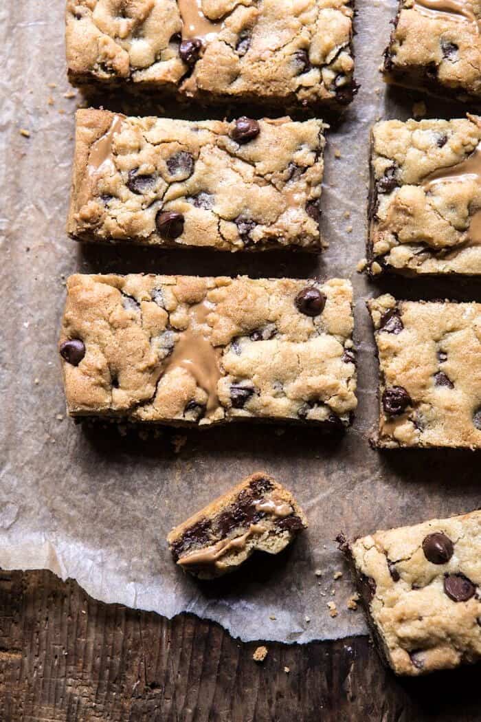 The Best Chocolate Chip Peanut Butter Swirled Cookie Bars | halfbakedharvest.com #cookies #cookiebars #peanutbutter #chocolate close up of broken cookie bar