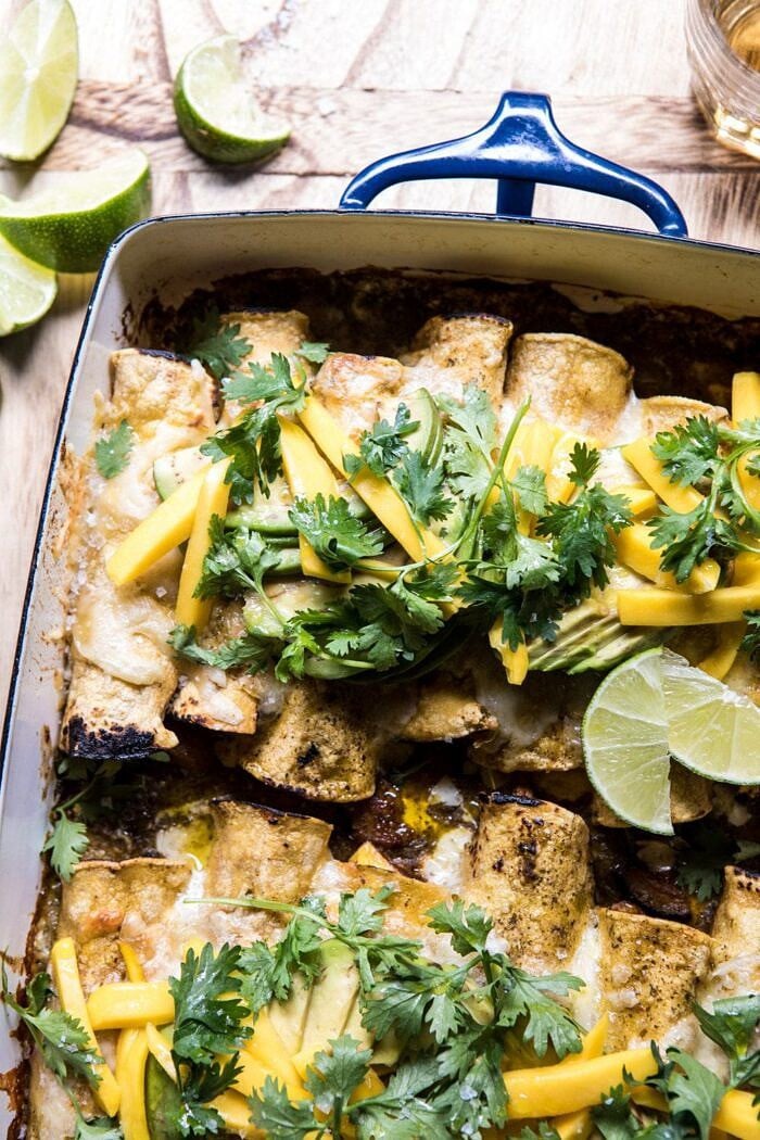 side angled photo of Salsa Verde Chicken and Zucchini Enchiladas with Mango | halfbakedharvest.com #mexican #enchiladas #zucchini #summerrecipes #easy