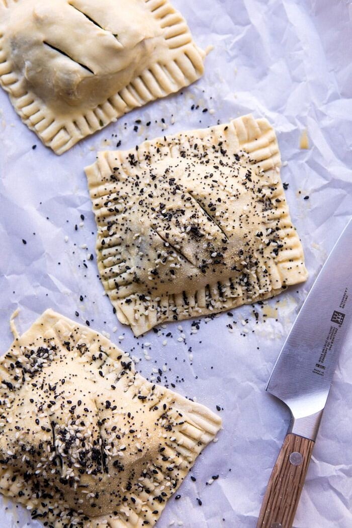 overhead photo Caramelized Onion, Spinach, and Cheddar Flaky Pastries before baking on baking sheet