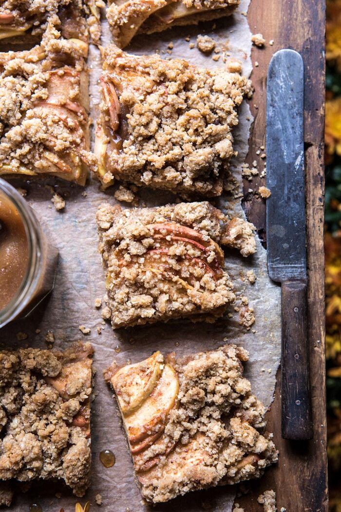 Double the Streusel Apple Butter Bars | halfbakedharvest.com #apples #fallrecipes #applebutter #applebars overhead photo of Double the Streusel Apple Butter Bars with knife and apple butter in photo