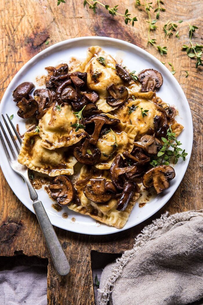 Herby Buttered Balsamic Mushroom Ravioli | halfbakedharvest.com #mushrooms #italian #ravioli #easyrecipes close up photo of Herby Buttered Balsamic Mushroom Ravioli