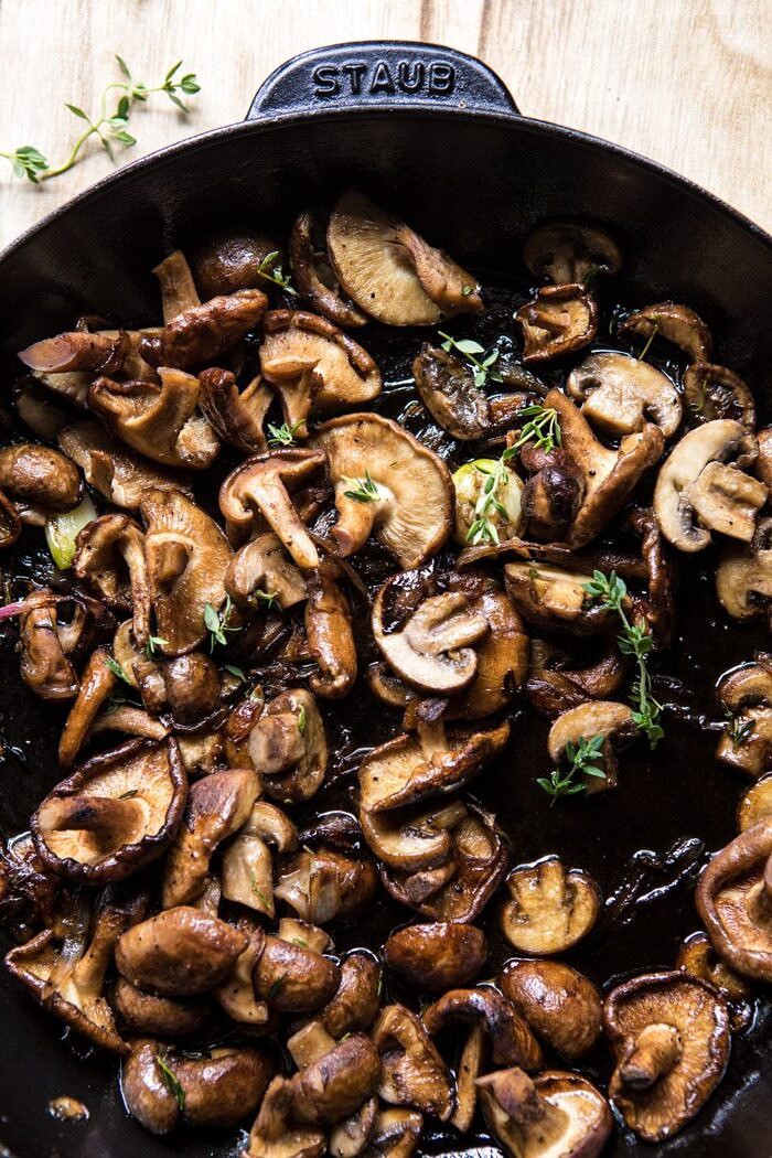 Herby Buttered Balsamic Mushroom Ravioli | halfbakedharvest.com #mushrooms #italian #ravioli #easyrecipes overhead photo of Herby Buttered Balsamic Mushrooms in skillet