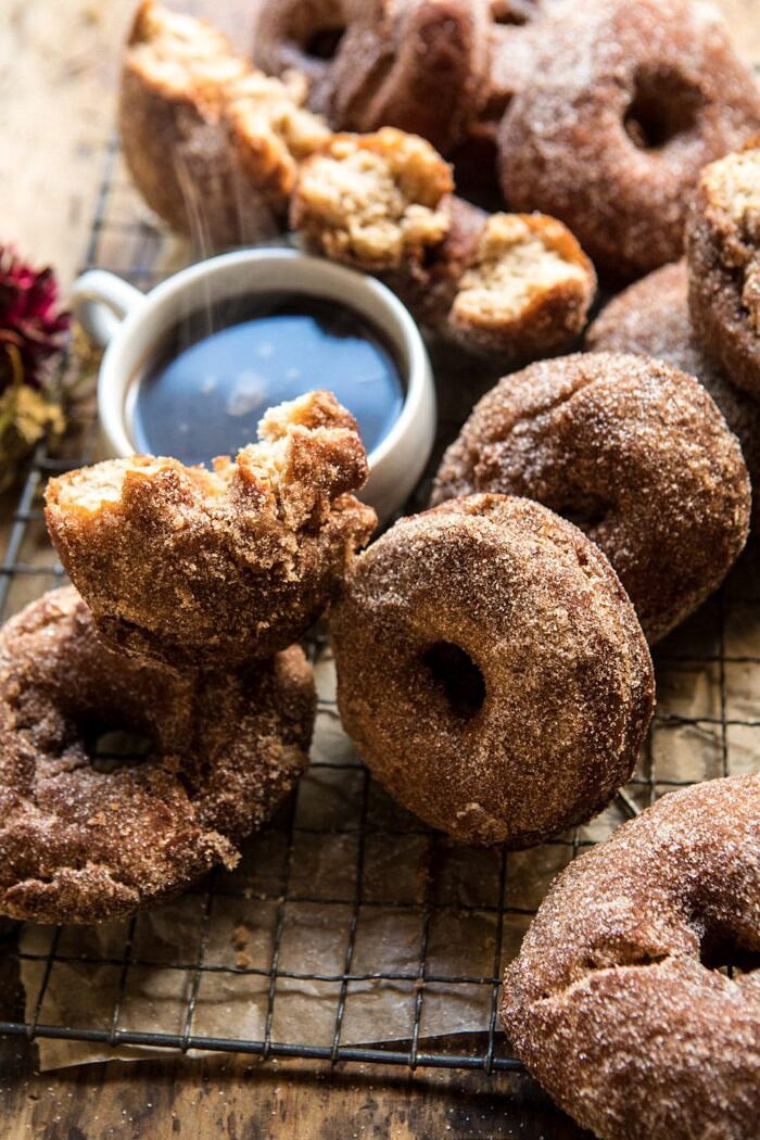 Mulled Spiced Apple Cider Doughnuts | halfbakedharvest.com #applecider #cinnamonsugar #doughnuts #applebutter #maple #fall #autumn #harvest side angle photo of Mulled Spiced Apple Cider Doughnuts with steaming coffee